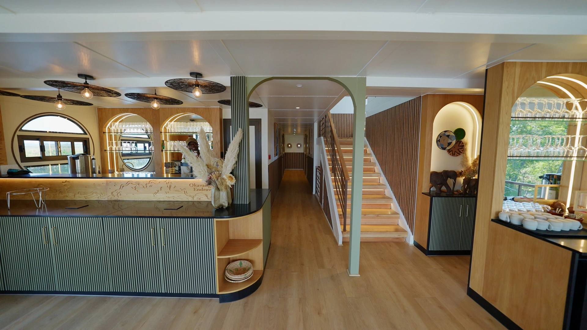 Bar and hallway with staircase on board the Okavango Endeavour