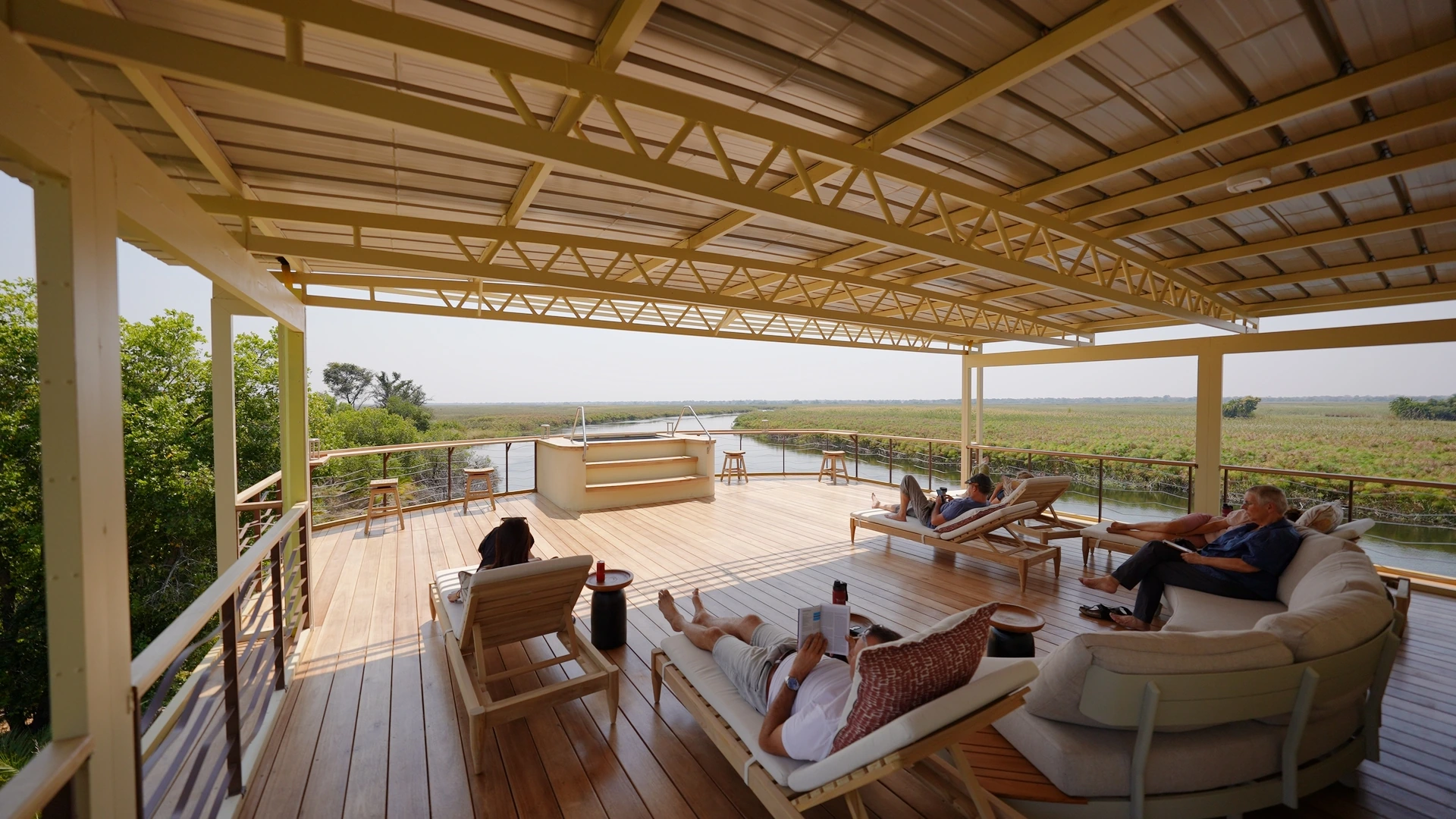 Shaded sun deck lounge on the Okavango Endeavour with views across the floodplain